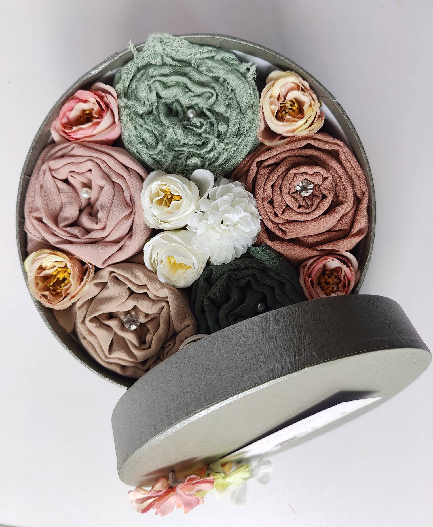An open Tahani Boutique hijab gift box, flat-lay view
