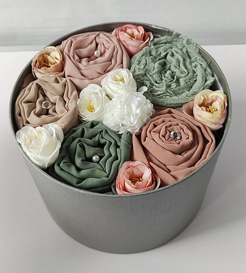 A handcrafted Tahani Boutique hijab gift box, finished with fabric roses