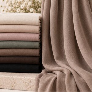 Cotton viscose hijabs folded in a stack with one draped alongside, showing the natural breathable weave